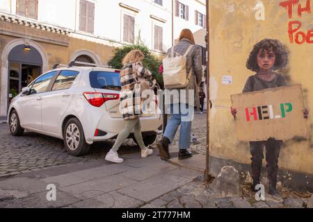 Rom, Italien. November 2023. Ansicht des neuen Wandgemäldes mit dem Titel „Hilfe Palästina“, erstellt von Straßenkünstler TvBoy in Borgo Pio in Rom (Foto: Matteo Nardone/Pacific Press) Credit: Pacific Press Media Production Corp./Alamy Live News Stockfoto