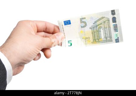 Detail der Hand eines Geschäftsmannes mit fünf Euro in Banknoten Stockfoto