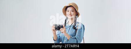 Voll isolierte Studio Bild von einer jungen und schönen Frau mit Kamera Stockfoto