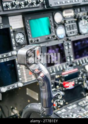 Interior view of helicopter Agusta cockpit with control lever, dashboard, displays, selected focus Stockfoto