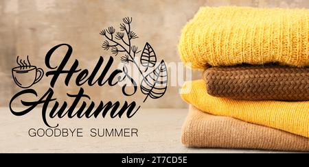 Banner mit verschiedenen warmen Pullis und Text HALLO, HERBST. AUF WIEDERSEHEN, SOMMER Stockfoto