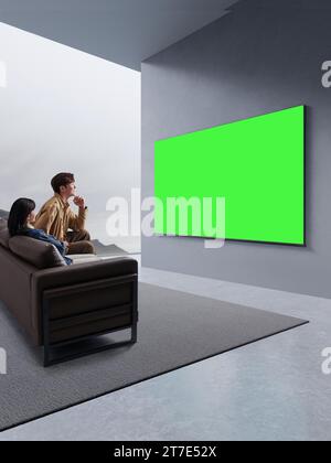 Die Menschen schauen und genießen neben dem Fernseher, Monitor mit grünem Bildschirm Stockfoto