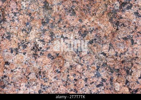 Natürliches rotes Granitsteinmuster, Nahaufnahme Hintergrundfotostruktur Stockfoto