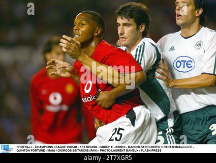 FUSSBALL - CHAMPIONS LEAGUE 2003/04 - 1. RUNDE - GRUPPE E - 030916 - MANCHESTER UNITED GEGEN PANATHINAIKOS FC - QUINTON FORTUNE (MAN) / GIORGOS SEITARIDIS (PAN) - FOTO LAURENT BAHEUX / FLASH PRESS Stockfoto