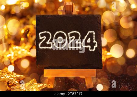 17. November 2023: Happy New Year 2024, symbolisches Bild der Jahreswende an Silvester. Schriftzug 2024 auf einem Schild FOTOMONTAGE *** Frohes Neues Jahr 2024, Symbolbild Jahreswechsel an Silvester. Schriftzug 2024 auf einem Schild FOTOMONTAGE Credit: Imago/Alamy Live News Stockfoto