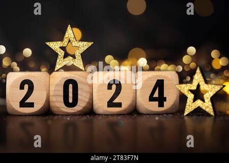 17. November 2023: Happy New Year 2024, symbolisches Bild der Jahreswende an Silvester. Holzwürfel mit der Inschrift 2 0 2 4 FOTOMONTAGE *** Frohes Neues Jahr 2024, Symbolbild Jahreswechsel an Silvester. Holz Würfel mit der Aufschrift 2 0 2 4 FOTOMONTAGE Credit: Imago/Alamy Live News Stockfoto