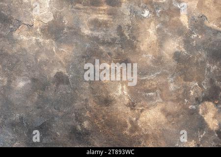 Hintergrund einer alten Steinmauer mit Spuren von Feuer. Stockfoto