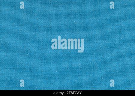 Blauer Sackleinen mit schöner Leinwandstruktur aus blauem Stoff im Retro-Stil mit schöner blauer Leinwandstruktur als Vintage Sackleinen für Hintergrund und Stockfoto