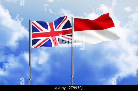 Indonesien, britische Fahnen zusammen winken gegen blauen Himmel. Monaco, britische Fahnen zusammen Stockfoto