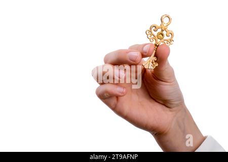 Hand mit einem Metallschlüssel im Retro-Stil auf weißem Hintergrund Stockfoto