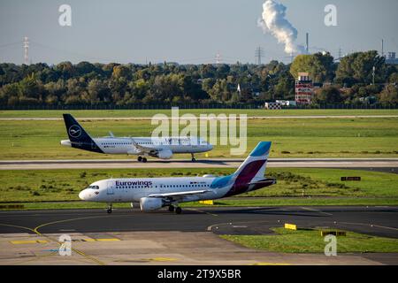 Flughafen Düsseldorf, Lufthansa Airbus A320-200 und Eurowings Airbus A319-100 auf dem Rollweg, Stockfoto