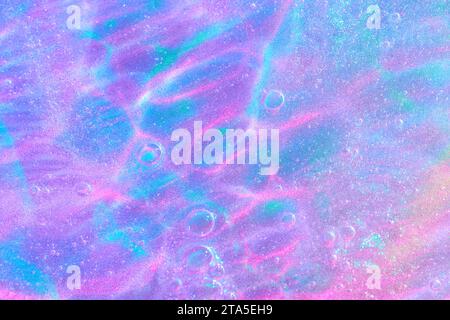 Lila, rosa, blau transparenter Raum Alien Glitter Schleim Gel Hintergrund Textur Stockfoto