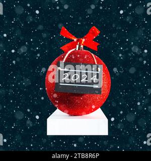 Rote Weihnachtskugel mit Poster. Inschrift 2024. Schneefall, Neujahrskarte. Stockfoto