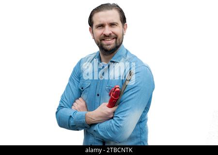 Junger, lächelnder Soldat, der in einem jeans-Hemd in die Kamera schaut. Stockfoto