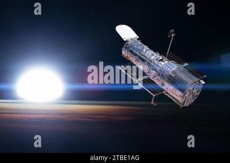 Weltraumteleskop, über dem Planeten Erde, mit Sonnenlicht. Elemente dieses Bildes, bereitgestellt von der NASA. Stockfoto