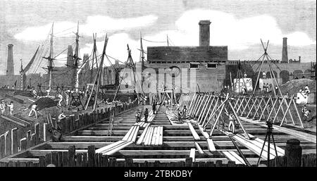 London Main Drainage: Pumpstation am Deptford Creek, 1861. "Die südliche Kanalisation soll sich von Wandsworth nach Deptford erstrecken, durch Battersea-Felder zur Brixton-Road und entlang der niedrigen Distrikte bis zu ihrer Kreuzung mit dem Abfluss bei Deptford, in den sie durch Pumpen angehoben werden muss. Der Entwässerungsbereich dieses Kanals ist etwa 22 Quadratkilometer groß. Zwei weitere Nebenkanäle sind notwendig, um die Entwässerung des südlichen Distrikts abzuschließen - eine von Bermondsey nach Deptford, die andere, um die Entwässerung des Flusses Effra abzufangen. Der südliche Abflusskanal wird mitkommen Stockfoto