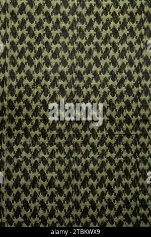 Keffieh Schal. Die Textur des traditionellen Baumwoll-symbolischen arabischen Schals. Khaki Hintergrund. Stockfoto