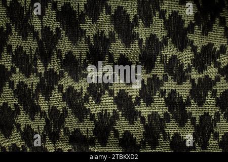Keffieh Schal. Die Textur des traditionellen Baumwoll-symbolischen arabischen Schals. Khaki Hintergrund. Stockfoto