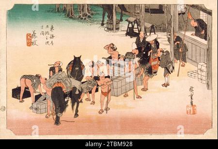 Pferdewechsel und Porter am Bahnhof Fujieda, zwischen 1833 und 1834. Serie: 53 Stationen des Tokaido, Nummer 23. Stockfoto