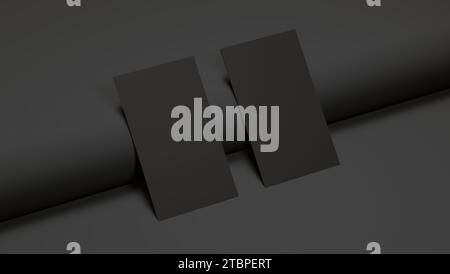 Mockup einer realistischen vertikalen schwarzen Visitenkarte auf schwarzem Hintergrund mit realistischen Schatten. Platz für Text- und Logofirma. Geschäftskonzept. Stockfoto