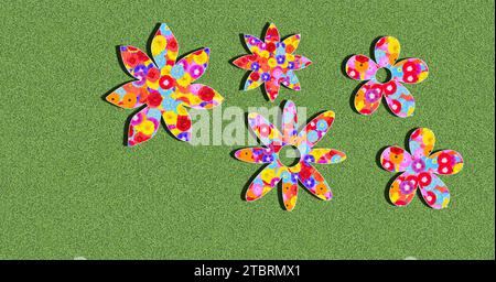 Silhouetten von Blumen, Muster, bunt, bunt, Illustration auf einem grünen Hintergrund im Sonnenlicht mit Schatten Stockfoto
