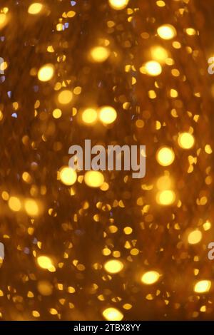 Wunderschöne goldene abstrakte unscharfe beleuchtete Lichter Bokeh für weihnachtlichen Hintergrund Stockfoto