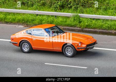 Orange Datsun 240Z aus den 1973 70er Jahren; Vintage, restaurierte klassische Motoren, Autosammler, Autofahrer, historische Veteranen, die im Großraum Manchester, Großbritannien, unterwegs sind Stockfoto