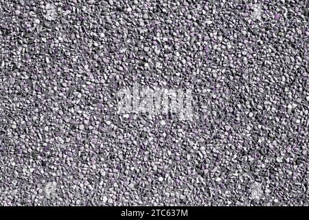 Kleiner Sandstein mit Sandwand Textur oder Sandwand Hintergrund. Natürlicher lila Sandstein für Design mit Kopierraum für Text oder Bild. Stockfoto