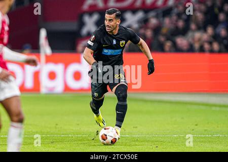 Amsterdam, Niederlande. Dezember 2023. AMSTERDAM, NIEDERLANDE - 14. DEZEMBER: Ehsan Haji Safi von AEK Athens dribbelt während des Gruppenspiels der UEFA Europa League 2023/24 zwischen Ajax und AEK Athen in der Johan Cruijff Arena am 14. Dezember 2023 in Amsterdam. (Foto von Andre Weening/Orange Pictures) Credit: Orange Pics BV/Alamy Live News Stockfoto