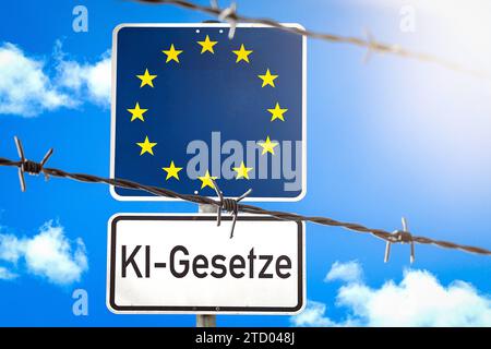 15. Dezember 2023: Schild mit EU-Flagge hinter einem Stacheldrahtzaun mit der Aufschrift AI Laws FOTOMONTAGE *** Schild mit EU-Flagge hinter einem Stacheldrahtzahn mit der Aufschrift KI-gesetze FOTOMONTAGE Stockfoto