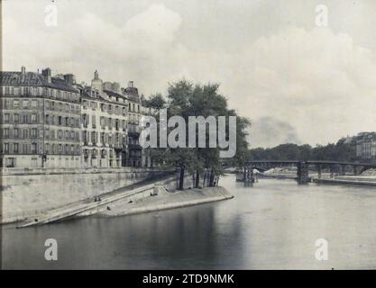 Paris (4.-5. Arr.), Frankreich die hölzerne Fußgängerbrücke, die vorübergehend die Pont de la Tournelle ersetzte, während des Wiederaufbaus, von der Pont de l'Archevêché, Wohngebäude, Architektur, Fluss, Arbeiten, Bauingenieurwesen, öffentliche Bauarchitektur, Kai, Installation vergänglich, Brücke, Frankreich, Paris, die hölzerne Fußgängerbrücke, die die Pont de la Tournelle vom alten Leichenschauhaus aus ersetzte, Paris, 29.05/1923 - 29.05.1923, Léon, Auguste, Fotograf, Autochrome, Foto, Glas, Autochrome, Foto, positiv, Horizontal, Format 9 x 12 cm Stockfoto