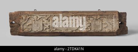 Interieuronderdeel, anonym, 1600 - 1650 Türkalb mit dem Jahr 1633 in einer Kartusche. Die Schnitzerei besteht aus Walzarbeiten. Die Kartusche wird von zwei Wappen flankiert, die mit einem Band zu Fuß mit der Kartusche verbunden sind. Das linke Schild zeigt eine diagonal verlaufende Stange mit drei Enten, das rechte ein Haus mit Vorder- und Hinterfassade, gekrönt von einer Ente. Eiche . Nördliche Niederlande (möglicherweise)Niederlande (möglicherweise) Holz (Pflanzenmaterial). Eiche (Holz) Türkalb mit dem Jahr 1633 in einer Kartusche. Die Schnitzerei besteht aus Walzarbeiten. Die Kartusche wird von zwei Wappen flankiert Stockfoto