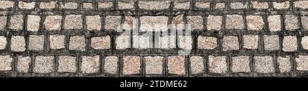 Mauerwerk aus Steinen oder Blöcken. Rustikale alte Steinmauer mit verschiedenen Größen von Felsen Stockfoto