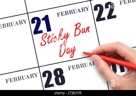 Februar. Text per Hand schreiben: Sticky Bun Day am Kalenderdatum. Speichern Sie das Datum. Urlaub. Tag des Jahres-Konzept. Stockfoto