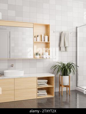 Inneneinrichtung eines modernen, minimalen Badezimmers mit minimalem Holzwaschbecken, Spiegel mit Schrank, Zimmerpflanze, Handtuch auf einem Regal und Fliesenwänden Stockfoto