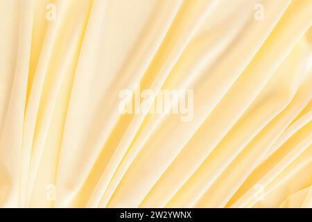Schöne abstrakte Farbe gelb, Chiffon, Satin, Seidenhintergrund aus weichem Fabrikgewebe. Abstrakter Hintergrund. Layout für Design. Ein Kopierbereich. Stockfoto