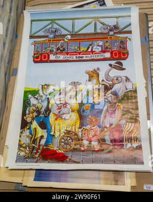 Auf der Auktion werden alte Plakate verkauft - 100 Jahre Wuppertaler Zoo-Zeichentricktiere und Schwebebahn 1981 Stockfoto