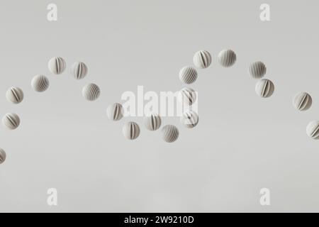 3D-Rendering einer Reihe von gestreiften Kugeln, die vor weißem Hintergrund schweben Stockfoto