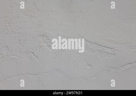 Textur einer grauen Putzwand mit Relief. Stockfoto