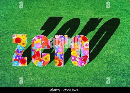 Das englische Wort Zero, geschrieben mit einem Blumenmuster aus vielen verschiedenen Blumen und Farben, Symbol für Net Zero, keine Kohlendioxidemissionen, Symbol Stockfoto