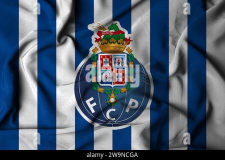 Selektiver Fokus des FC Porto Logos. Portugiesischer Fußballverein, Stadt porto. Mit fließender Stoffstruktur. 3D-Abbildung Stockfoto