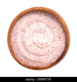 Himalaya rosa Salz fein, in einer Holzschale. Feines Himalaya-Salz, Steinsalz und Halit mit rosafarbener Färbung, durch Spuren von Mineralien. Stockfoto