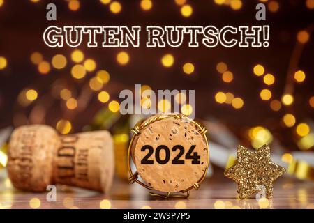 29. Dezember 2023: Happy New Year 2024 Konzept, Feuerwerk Schriftzug Guten Rutsch und ein Sektkorken mit der Jahreszahl 2024 FOTOMONTAGE *** Frohes neues Jahr 2024 Konzept, Feuerwerk Schriftzug Guten Rutsch und ein Sektkorken mit der Jahreszahl 2024 FOTOMONTAGE Stockfoto