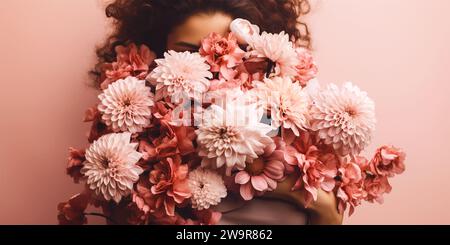 Schöne Frau, die Blumen umarmt, Selbstliebe Stockfoto