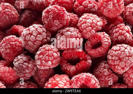 Gefrorene Himbeeren bedeckt mit Raureif. Beeren Hintergrund. Stockfoto