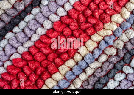 Detail der diagonalen Muster des gestrickten Stoffes eines Teppichs Stockfoto