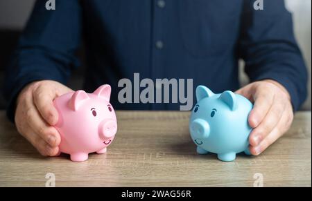 Zwei Schweinebänke, die gegensätzliche Geschlechter symbolisieren. Eigentumsrechte bei Heirat und Scheidung von Ehegatten. Geteiltes Budget für Ausgaben. Das Kredithisto Stockfoto