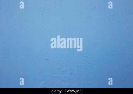 Die Textur einer alten, schäbigen blauen Wand. Hintergrund der alten Betonwand. Stockfoto