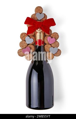 Flasche Sekt gebunden mit Band und Weinkorken isoliert auf weißem Hintergrund. Festlicher romantischer Valentinstag-Hintergrund Stockfoto