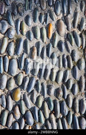 Rustikale Kieselmosaik-Pflasterstruktur, Nahaufnahme Stockfoto